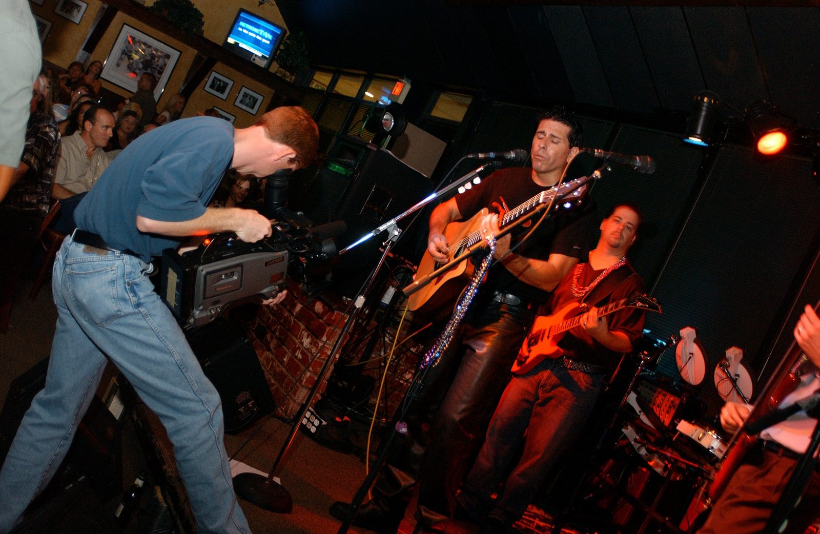 Tim McGeary performing live with his band in a club