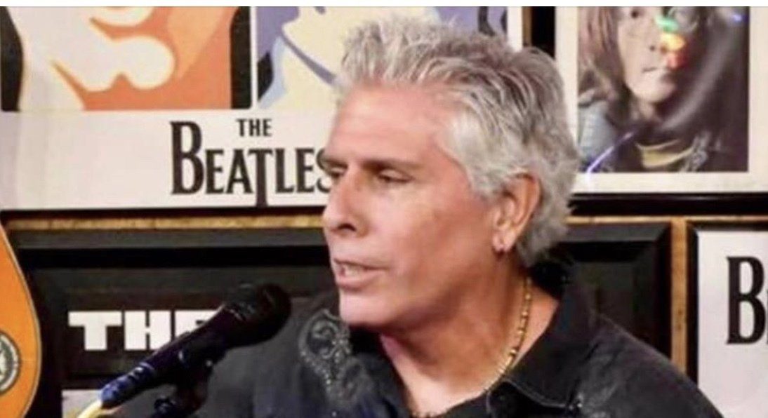 Tim McGeary performing in a songwriter round